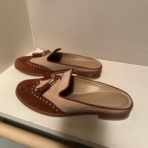 Two-toned suede wing tip mules with tassle